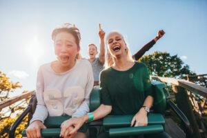 two people on roller coaster