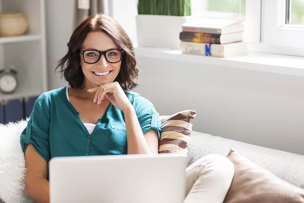 Woman with Glasses On Laptop